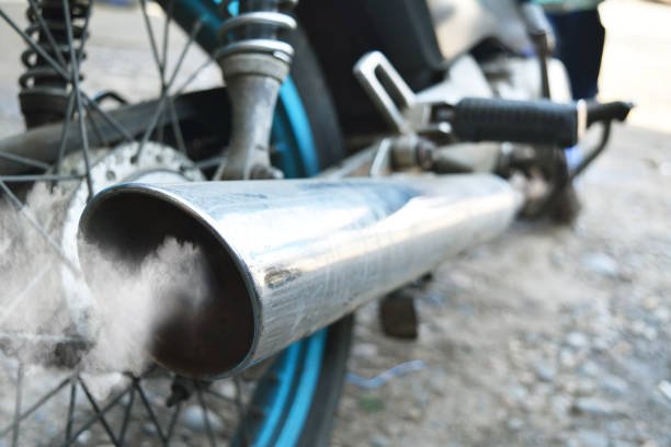air pollution from vehicle exhaust pipe close up